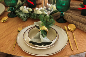 Festive table setting with Christmas decor indoors, closeup