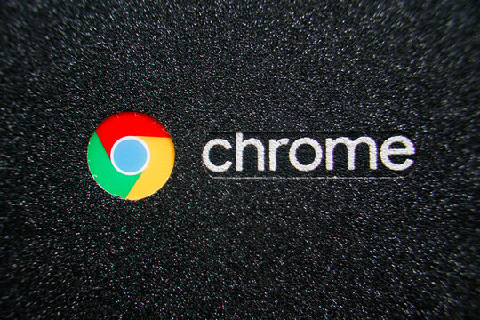 close up of google chrome logo on cover laptop