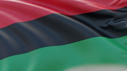 The flag of the Black Liberation Movement or Afro-American solidarity movement waving in the wind.