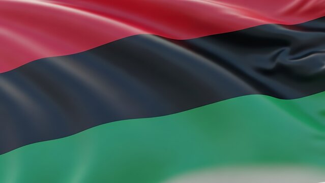 The flag of the Black Liberation Movement or Afro-American solidarity movement waving in the wind.