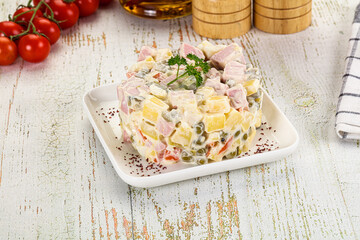 Russian traditional Olivier salad with sausages
