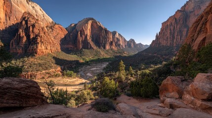 Dramatic red rock landscape in Zion National Park at golden hour with blue sky