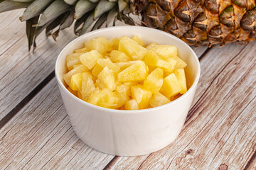 Sweet canned pineapple fruit pieces