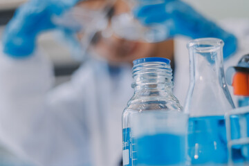 Portrait, science and happy woman on laptop in lab to research chemistry, test or innovation. Microscope, scientist and face of medical doctor in goggles for microbiology, healthcare or pharma study