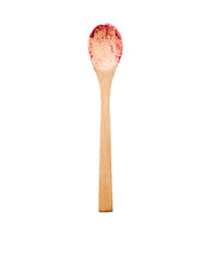 a wooden spoon with dried raspberries
