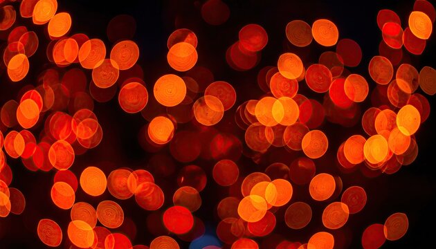 Abstract warm orange and red bokeh lights background.