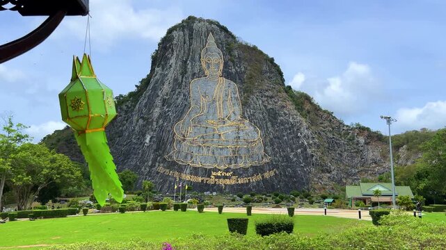 CHONBURI, Thailand - June 9, 2025: The Golden Buddha Mountain. The Buddha image carved into the rock of Khao Chi Chan, Khao Chion, Pattaya, engraved in gold,on a hill dedicated to His Majesty the King