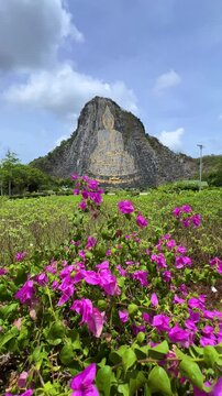 CHONBURI, Thailand - June 9, 2025: The Golden Buddha Mountain. The Buddha image carved into the rock of Khao Chi Chan, Khao Chion, Pattaya, engraved in gold,on a hill dedicated to His Majesty the King