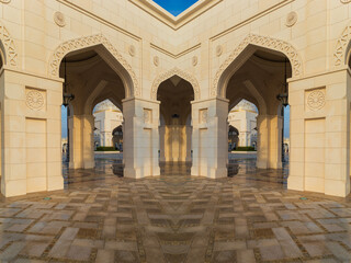 Fototapeta premium Elements of architecture of buildings, ancient arches, columns, windows and apertures. On the streets in Emirates, public places.