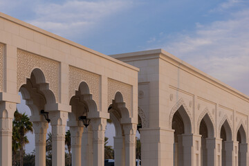 Fototapeta premium Elements of architecture of buildings, ancient arches, columns, windows and apertures. On the streets in Emirates, public places.