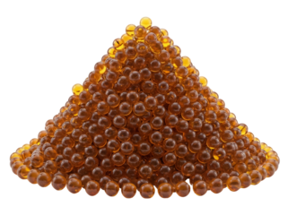 Pile of amber-colored gel capsules isolated PNG, nutritional supplement for health and wellness on transparent background