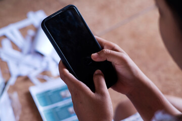 Close-Up Shot of Girl and Smartphone with Messy Paper Background