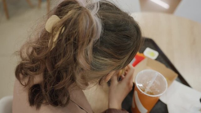 food spill embarrassment, uncomfortable food spill incident during crowded shopping experience, awkward situation involving spilled food amidst bustling mall shoppers and busy environment