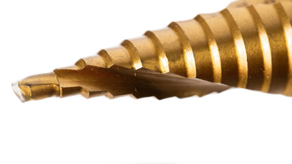 New step drill in screwdriver on white background, isolate. Concept of tools, close-up