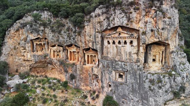 Aerial view of Caunos Tombs of the Kings in Dalyan, Turkey. Ancient Dalyan Rock Tombs. Explore ancient rock tombs of Lycia in Turkey revealing history and culture