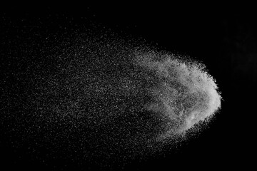 The falling white snow on a black background
