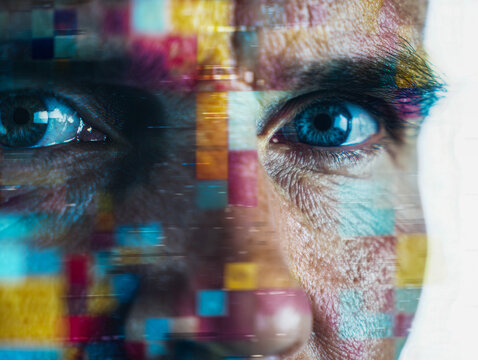 Blue eyes of a thoughtful man in an abstract digital virtual reality concept with colorful pixelated blocks and a futuristic technological interface design