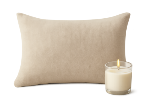 Beige rectangular pillow beside lit candle in glass jar on transparent background, cozy decor