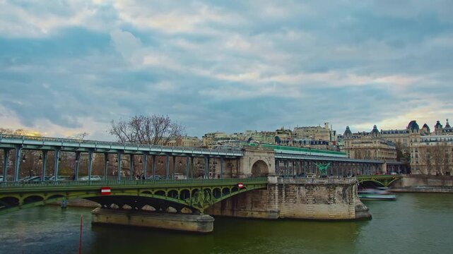 Paris, France - 26.08.2025 : The parisian urban subway passes over a bridge. The oldest green metro line, number 6 in Paris. Timelapse