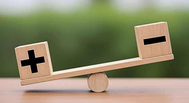 Wooden balance scale with plus and minus signs representing pros and cons decision making comparison and equilibrium on a blurred green background for business and finance concepts