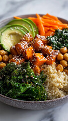 Vibrant bowl featuring roasted sweet potatoes chickpeas quinoa kale avocado and carrots garnished with sesame seeds offering nutritious and colorful meal