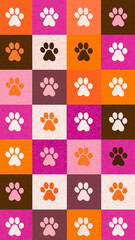 Seamless pattern featuring cute pastel pink, orange, and brown dog paw prints on colorful checkered background. playful design creates cheerful and vibrant atmosphere