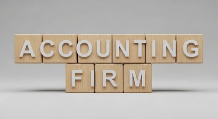 Accounting firm concept on wood blocks arranged on light backdrop