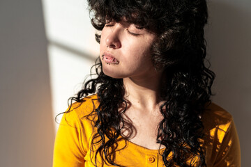 Latina woman embracing calm introspective presence