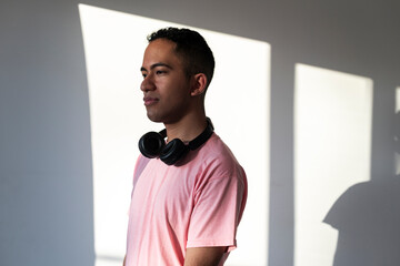 Latino man with laptop and headphones enjoying relaxed modern digital flow