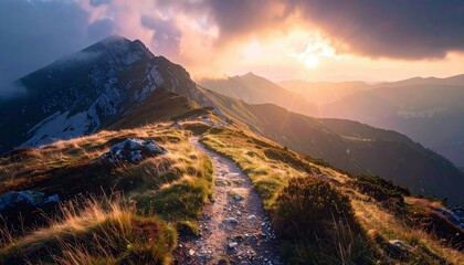 A scenic view of a hiking trail winding along a mountain ridge at sunset, with a dramatic sky and golden light.