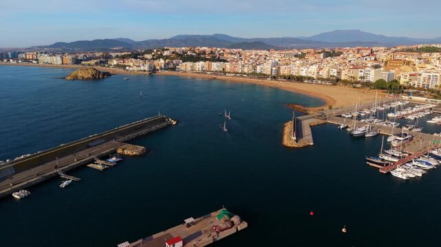Aerial view of blanes port with sailboats and coastline
