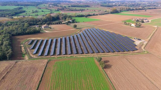 Aerial view of solar panels power station in the countryside