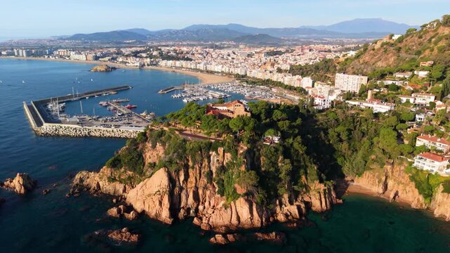 Aerial view of blanes cityscape and port in costa brava, spain