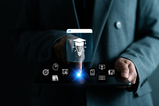 Businesswoman using digital tablet with virtual interface of online education. Modern e-learning, digital knowledge, distance education and remote training solutions for professional development.