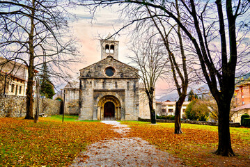 Exterior of the Monastery of Sant Pere de Camprodon in November with autumn leaves