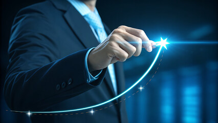 Businessman hand pointing to a bright star on an upward trending glowing blue graph line representing business growth, success, and financial achievement in a dark setting