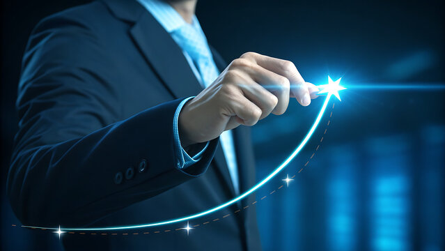 Businessman hand pointing to a bright star on an upward trending glowing blue graph line representing business growth, success, and financial achievement in a dark setting