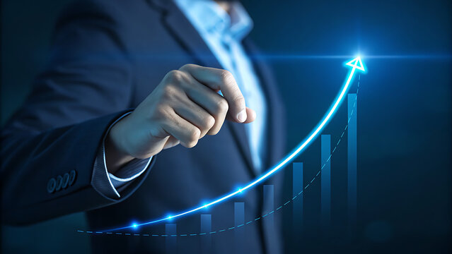 Businessman hand pointing towards a glowing blue upward trending arrow graph indicating business growth, success, and financial achievement in a dark setting