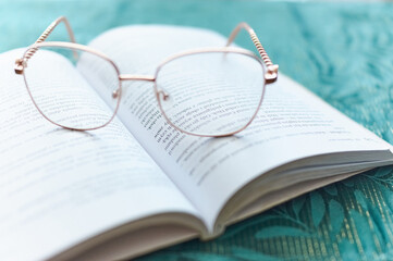 glasses on a book, learning and business © Mariusz