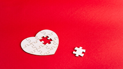 Heart puzzle with missing piece symbolizing love connection fit and emotional completeness
