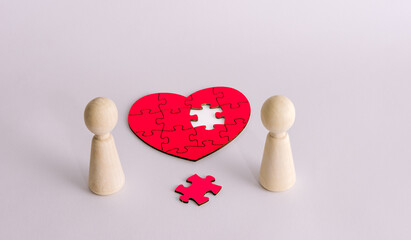 Couple figures with missing heart puzzle piece symbolizing love connection relationship concept