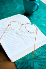glasses on a book, learning and business © Mariusz