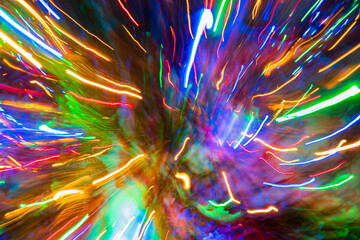 Bright colors swirl together, capturing the festive spirit of a lively event at night