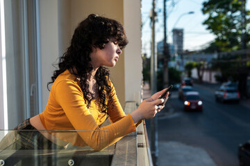 Woman using smartphone near busy urban street