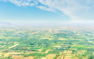 panoramic view from high mountain to a beautiful landscape with valley and fields of great lands far away.