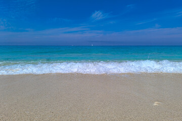 Famous beach on west part of Lefkada (Levkas) island, Ionian sea, Greece. A small boat on the open sea