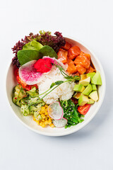 Vibrant sushi bowl with fresh salmon, avocado, and veggies for a healthy meal