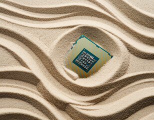 Semiconductor Microchip Peeking from Desert Sand with Copy Space