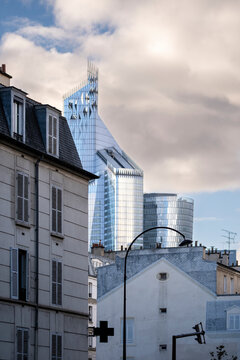 Architecture and skyscraper elements blend with residential and offices in an urban facade setting, creating contrast across mixed use structures throughout Paris in La Defense