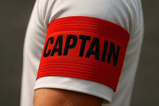 Red captain armband on player&rsquo;s arm